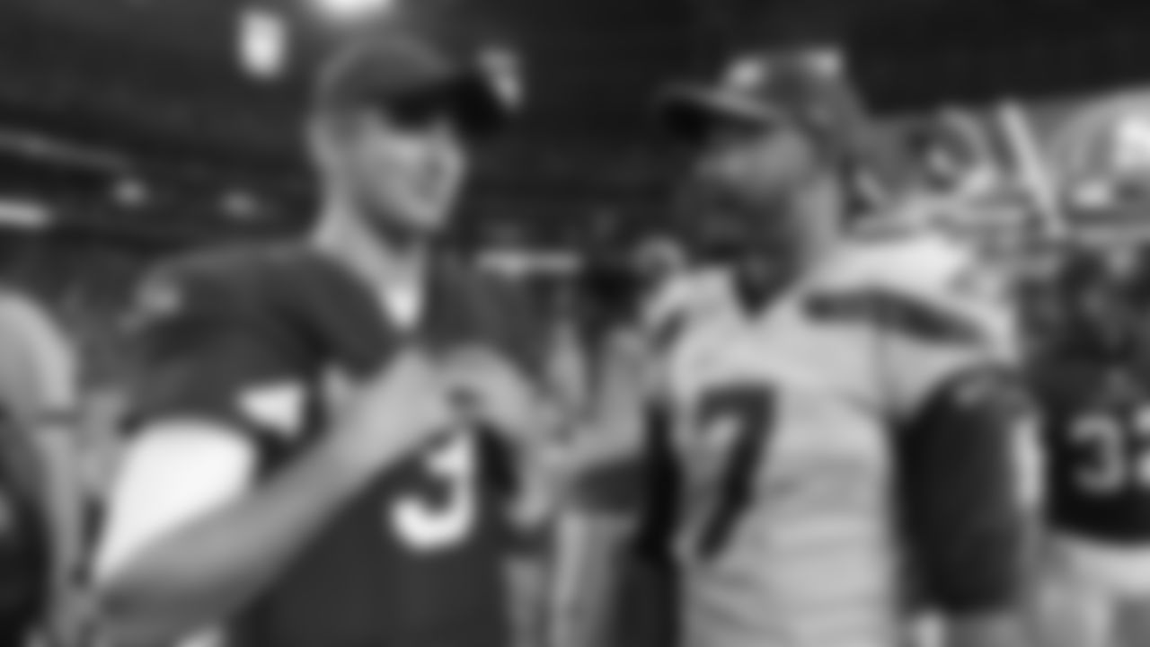 Brett Hundley (right) talks with Cardinals QB and fellow UCLA product Josh Rosen after a game in 2018.