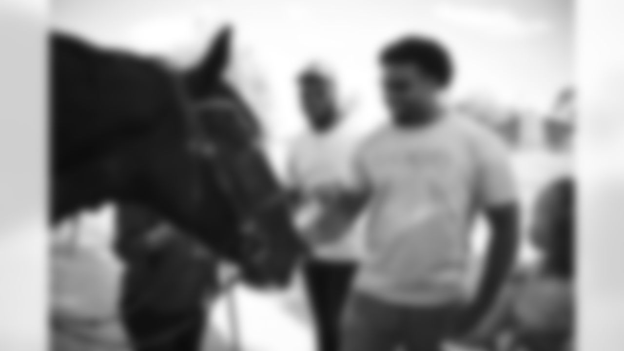 The Arizona Cardinals visit Hunkapi Farms to work with therapy horses and families with ALS on Saturday, May 13, 2023 in Scottsdale, AZ.