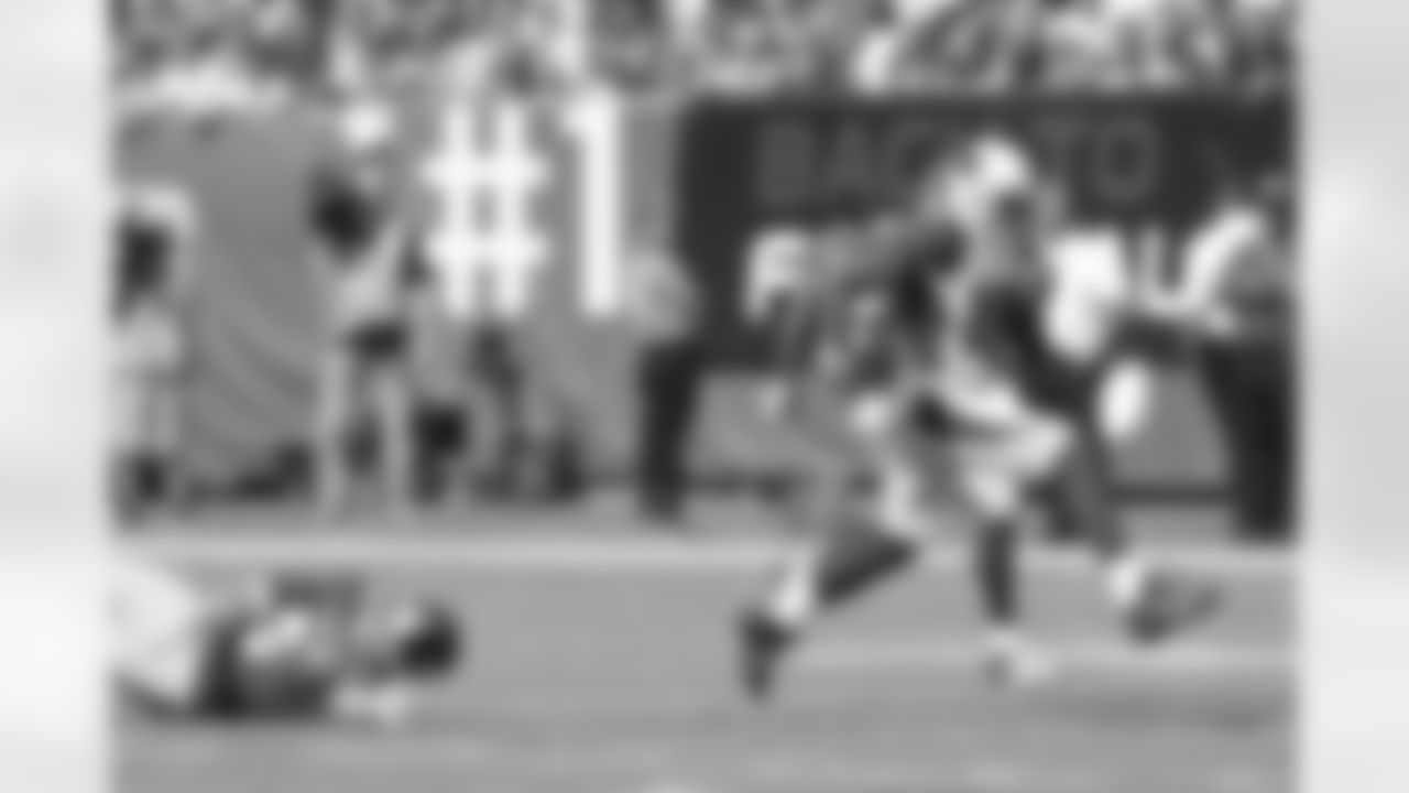 WR Ted Ginn returns a punt for a touchdown