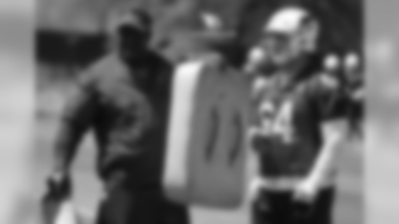 OL coach Ray Brown (left) and G/C Mason Cole