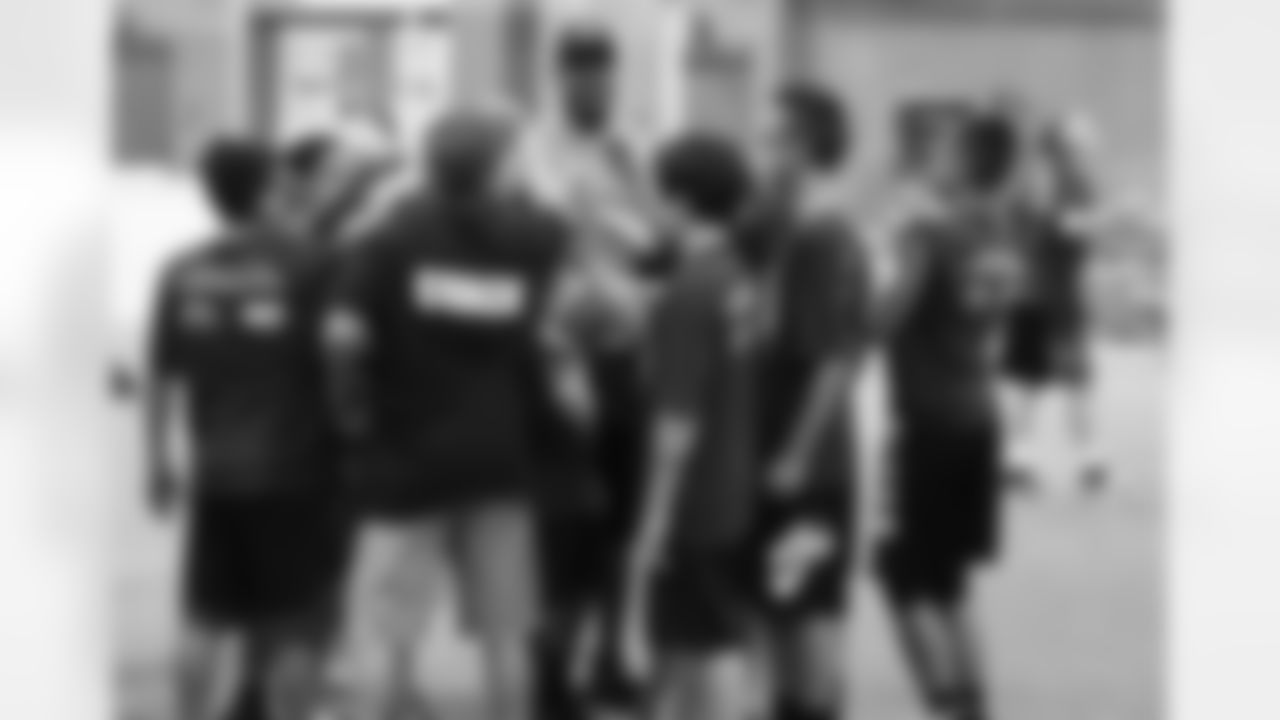 Johnson huddles up with campers