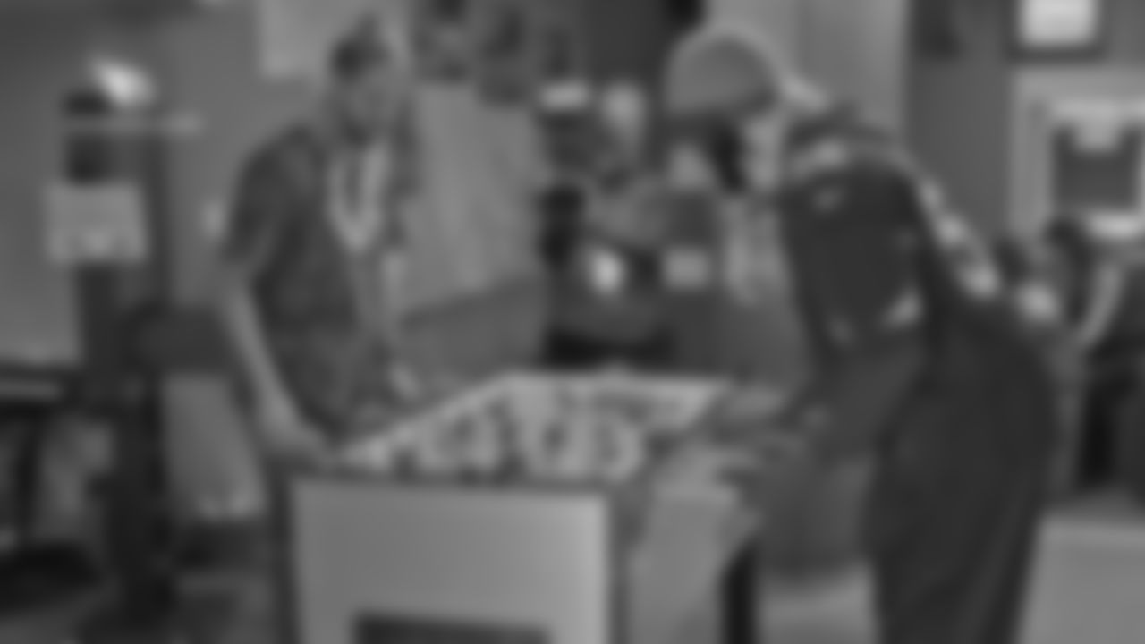 LS Aaron Brewer and DE Zach Moore face off in a game of foosball