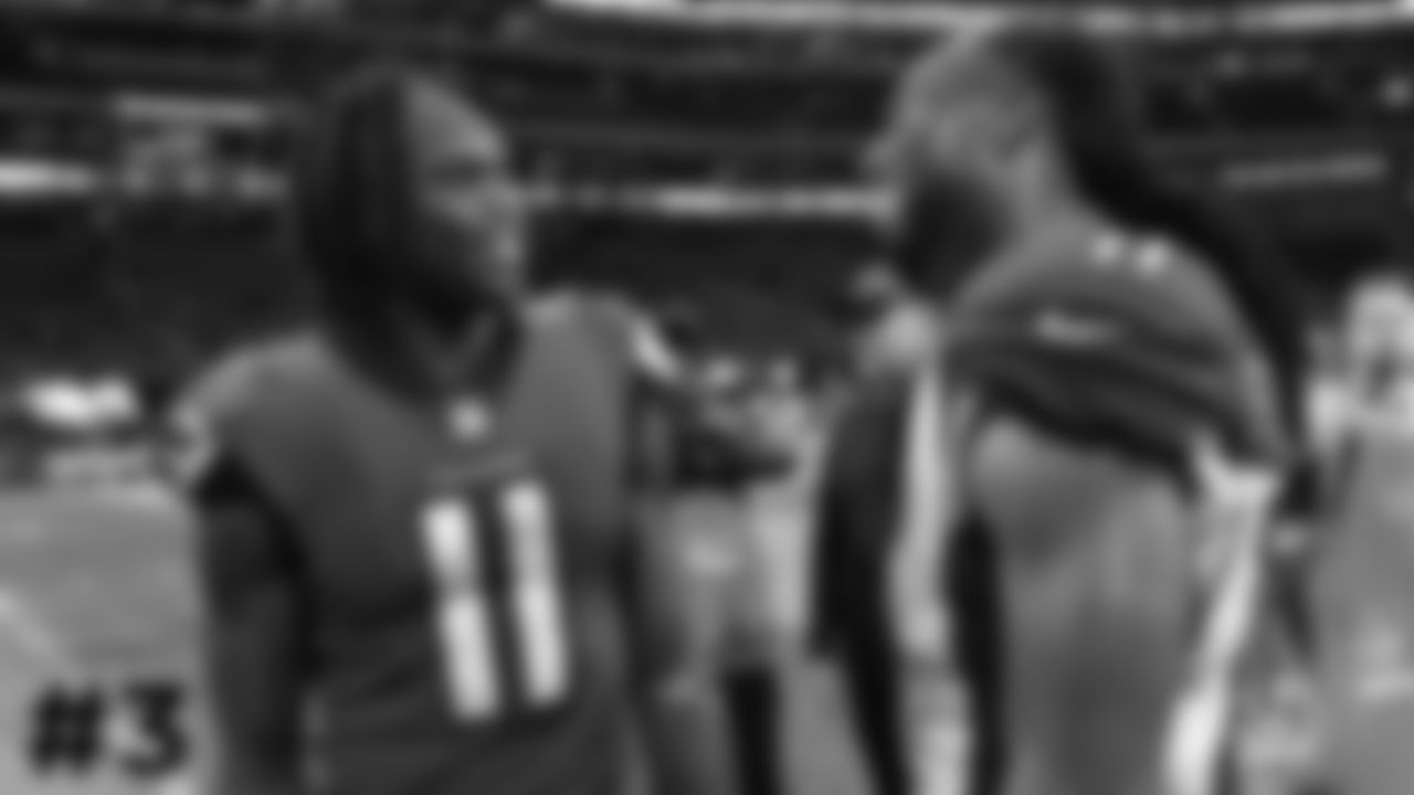 3. Falcons WR Julio Jones (left) and Cardinals WR Larry Fitzgerald catch up after the game