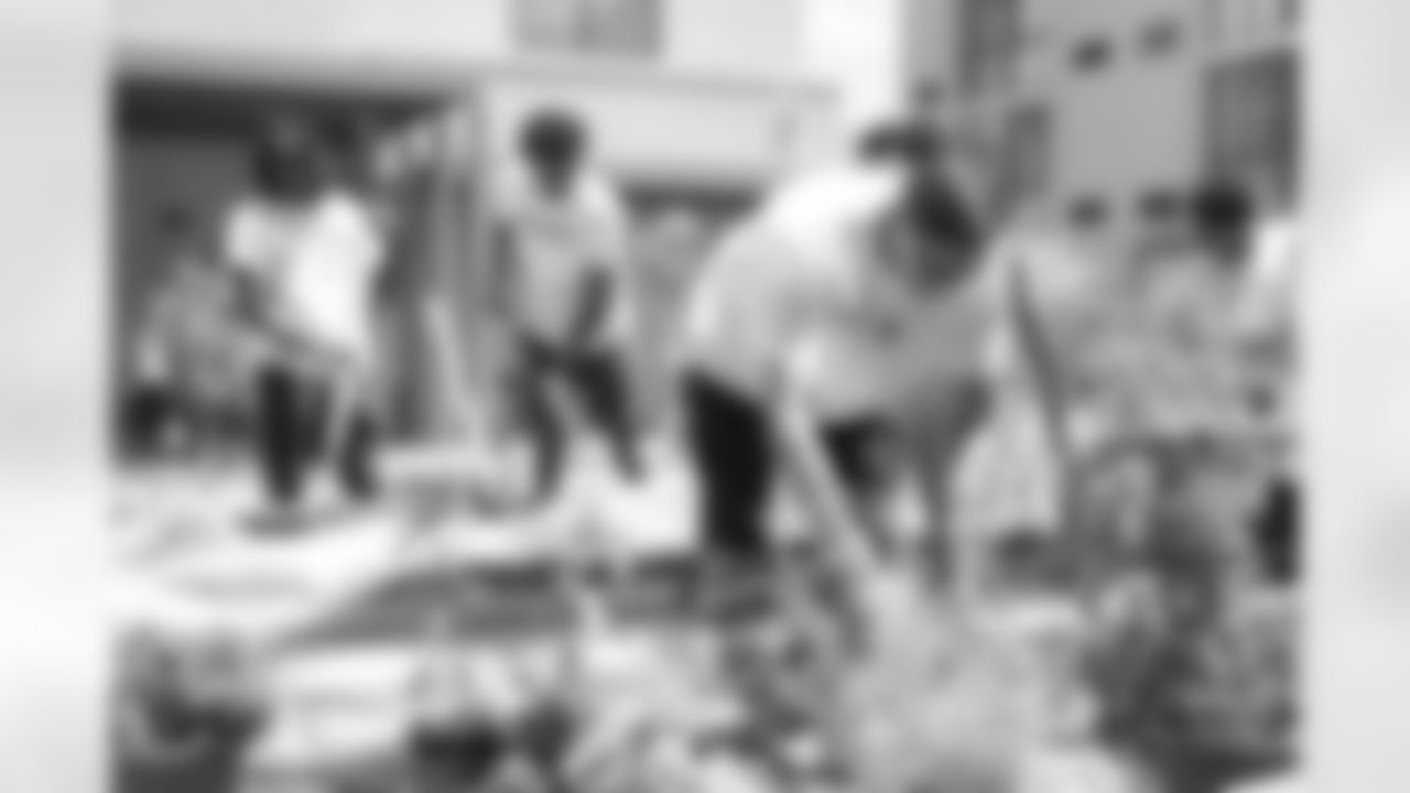 The Arizona Cardinals volunteer the Center of Opportunity homeless shelter with the University of Arizona football team during the Cardinals Caravan on Tuesday, June 1, 2023 in Tucson, AZ.