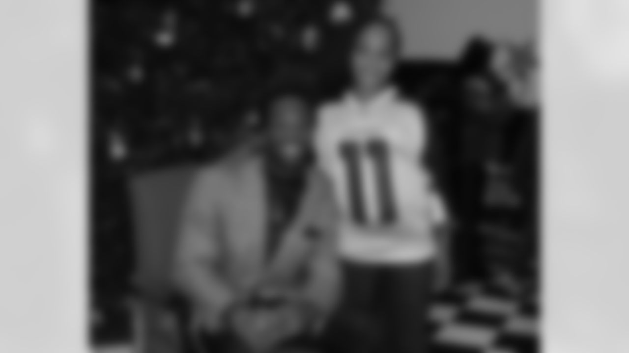 Larry Fitzgerald took pictures with about 200 children.