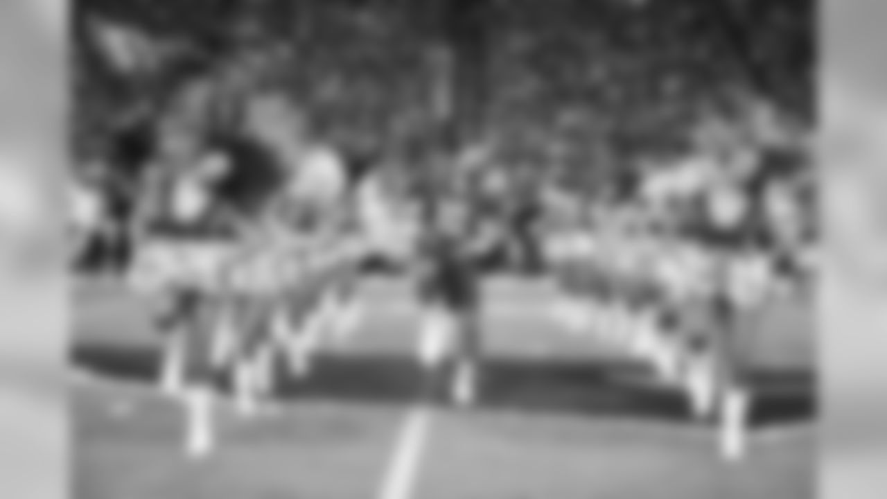 Images of the Cardinals cheerleaders practicing and performing with celebrity fitness motivator Shaun T