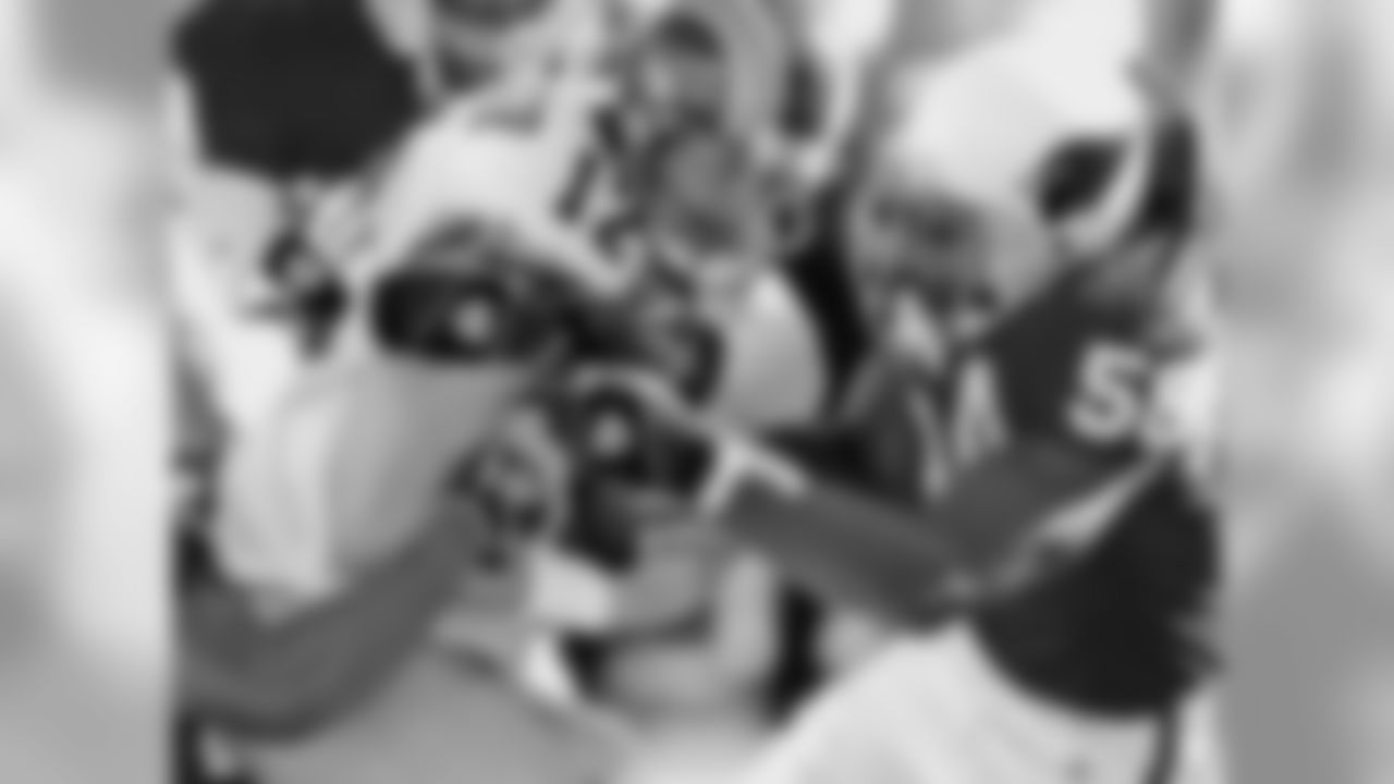 2004: LB Karlos Dansby wraps up Rams QB Chris Chandler