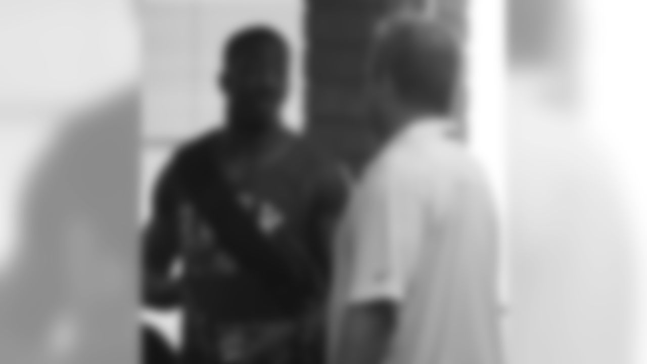 Sixth-round WR Walter Powell talks with VP of player personnel Terry McDonough