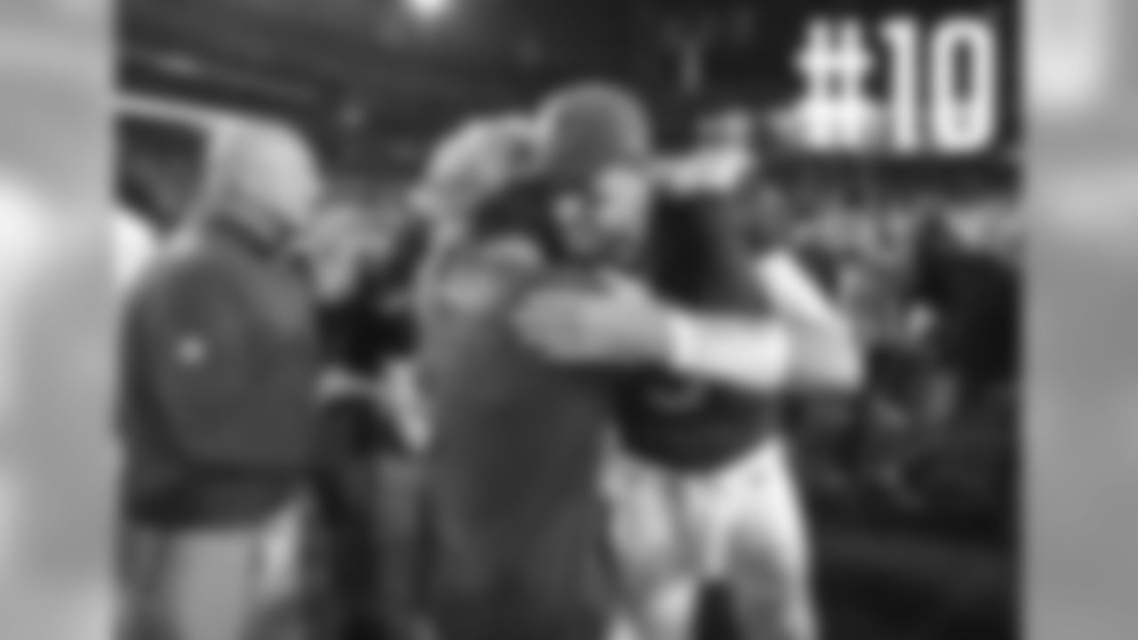QB Carson Palmer with a postgame hug for his former college coach, Pete Carroll