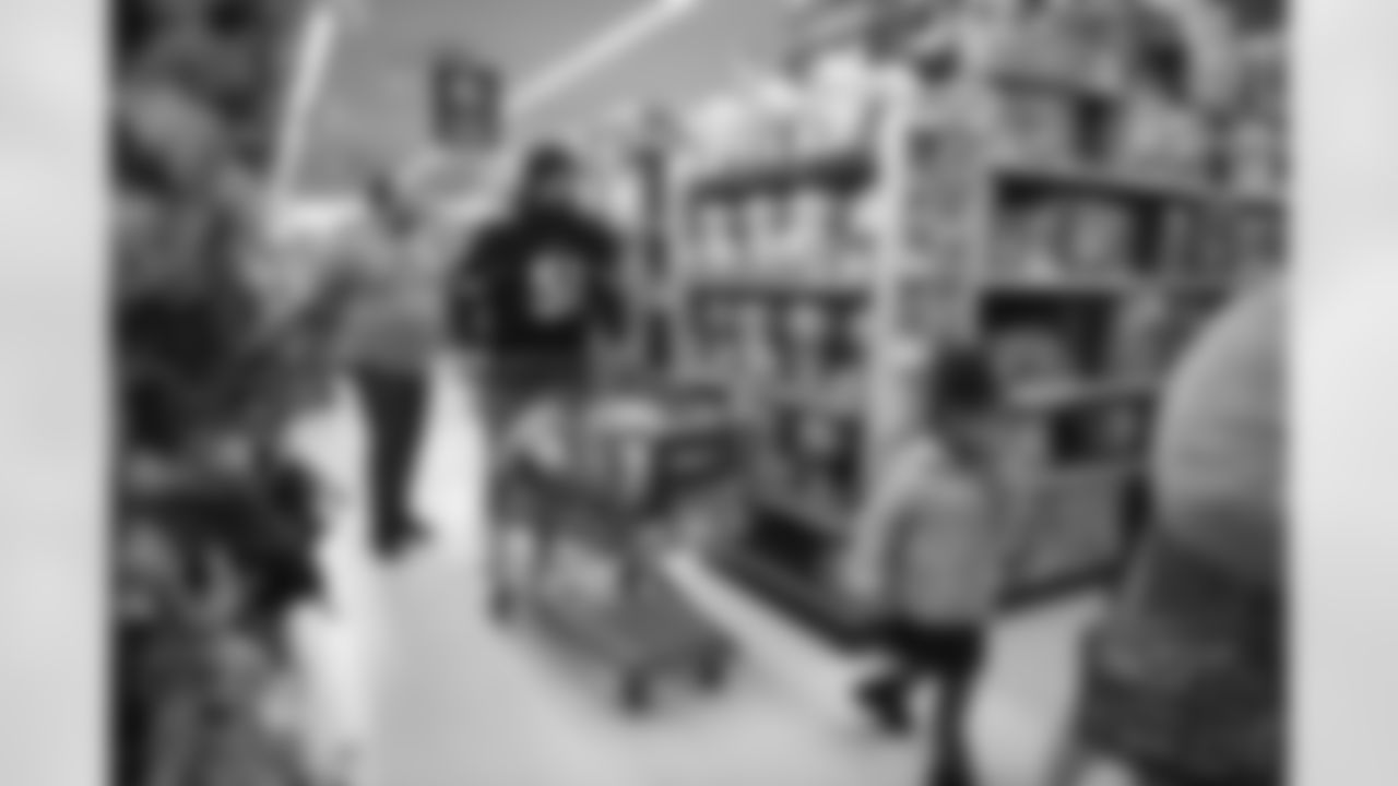 The Arizona Cardinals participate in Shop With A Jock with Desert Financial Credit Union at Walmart on Tuesday, December 13, 2022 in Tempe, AZ.