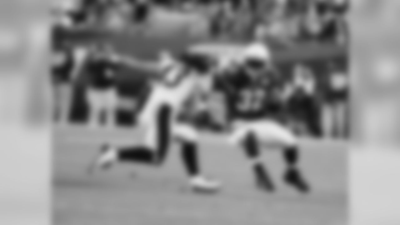 RB Edgerrin James crosses paths with Steelers S Troy Polamalu