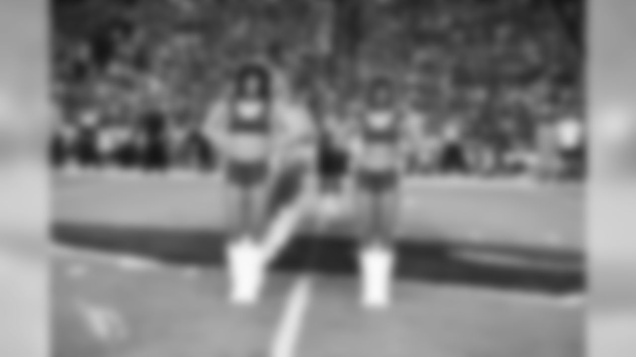Images of the Cardinals cheerleaders practicing and performing with celebrity fitness motivator Shaun T