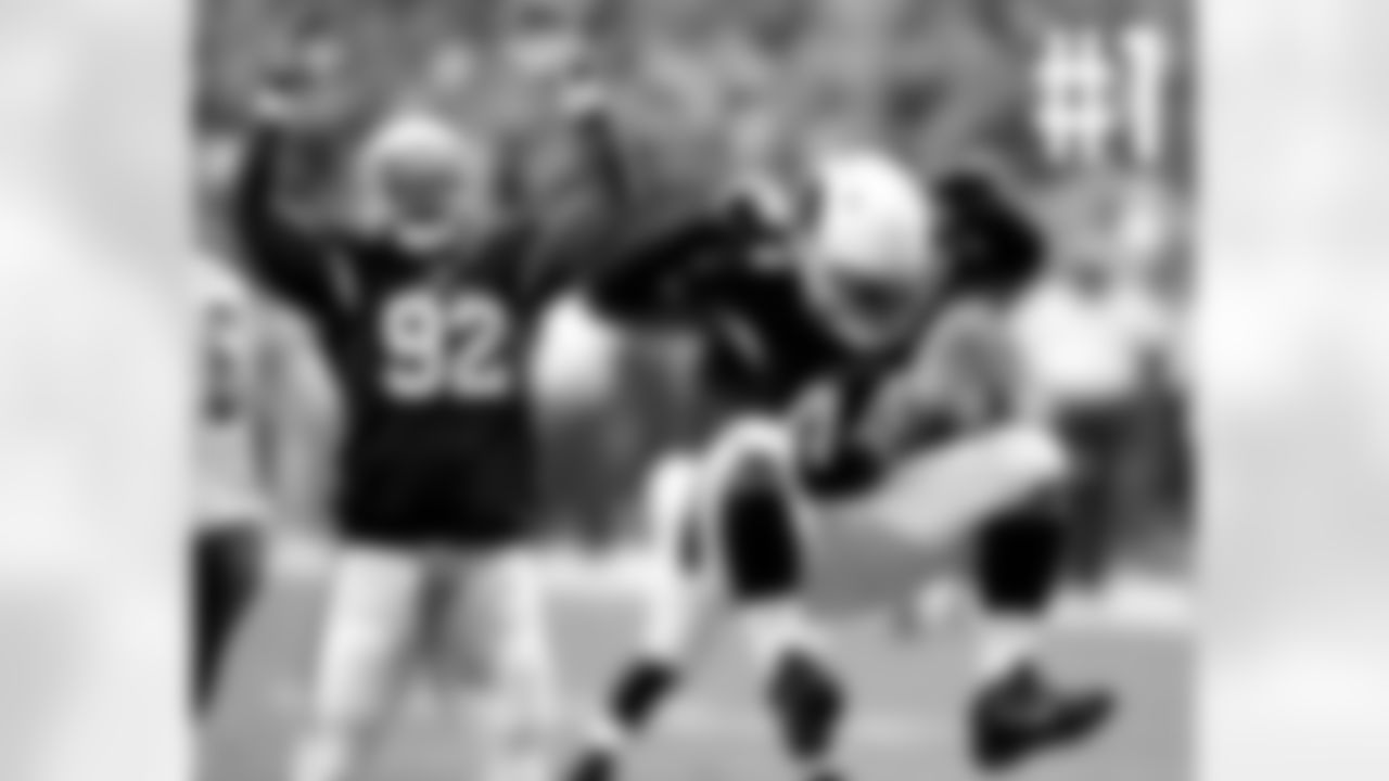 LB Markus Golden (right) and DT Frostee Rucker celebrate a sack