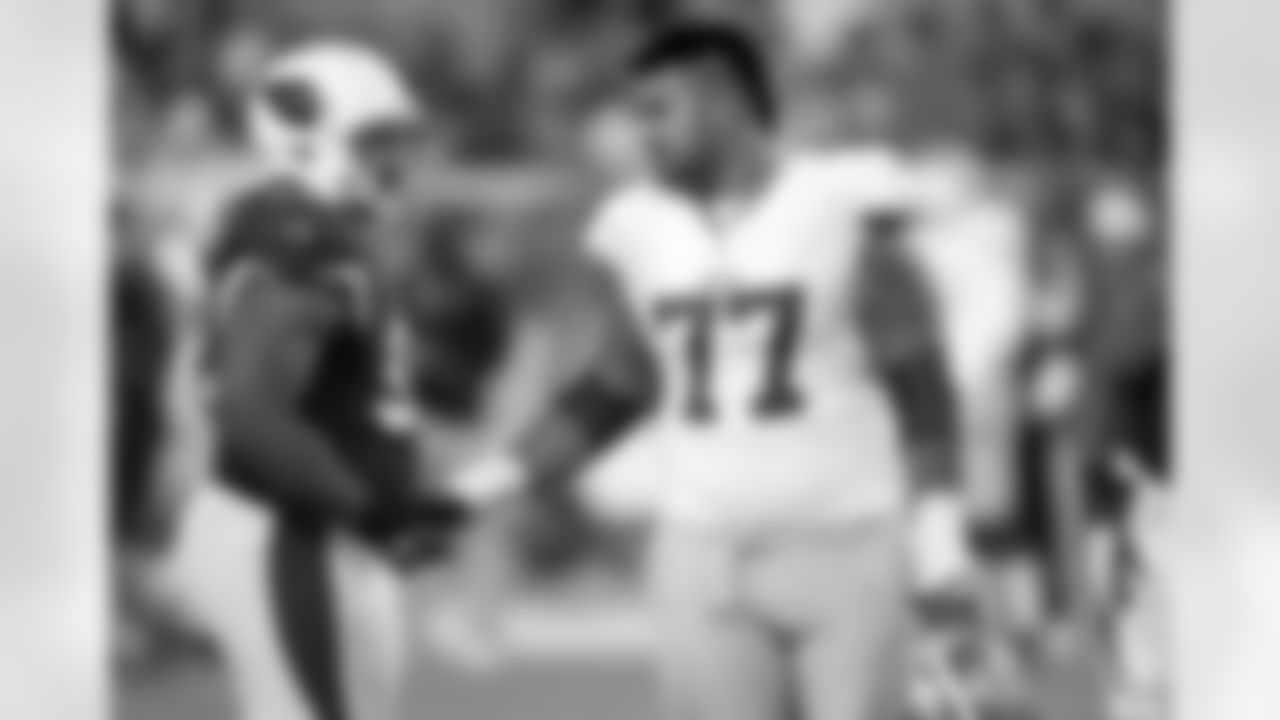 Iupati and Cards DT Dan Williams shake hands in 2012