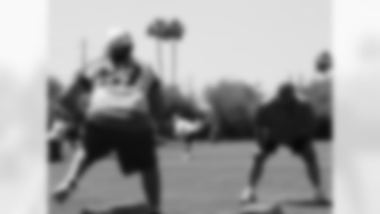 Offensive Line Coach Russ Grimm works the line