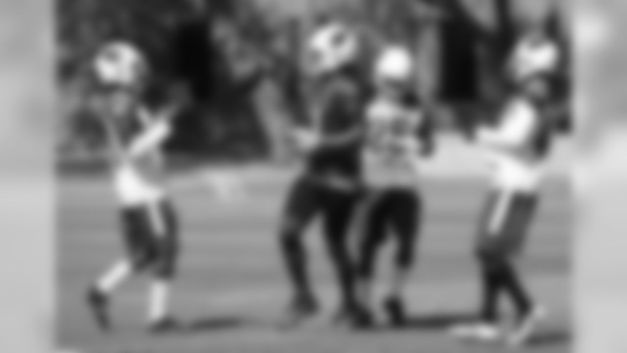 Post-play, WR Larry Fitzgerald flips the ball