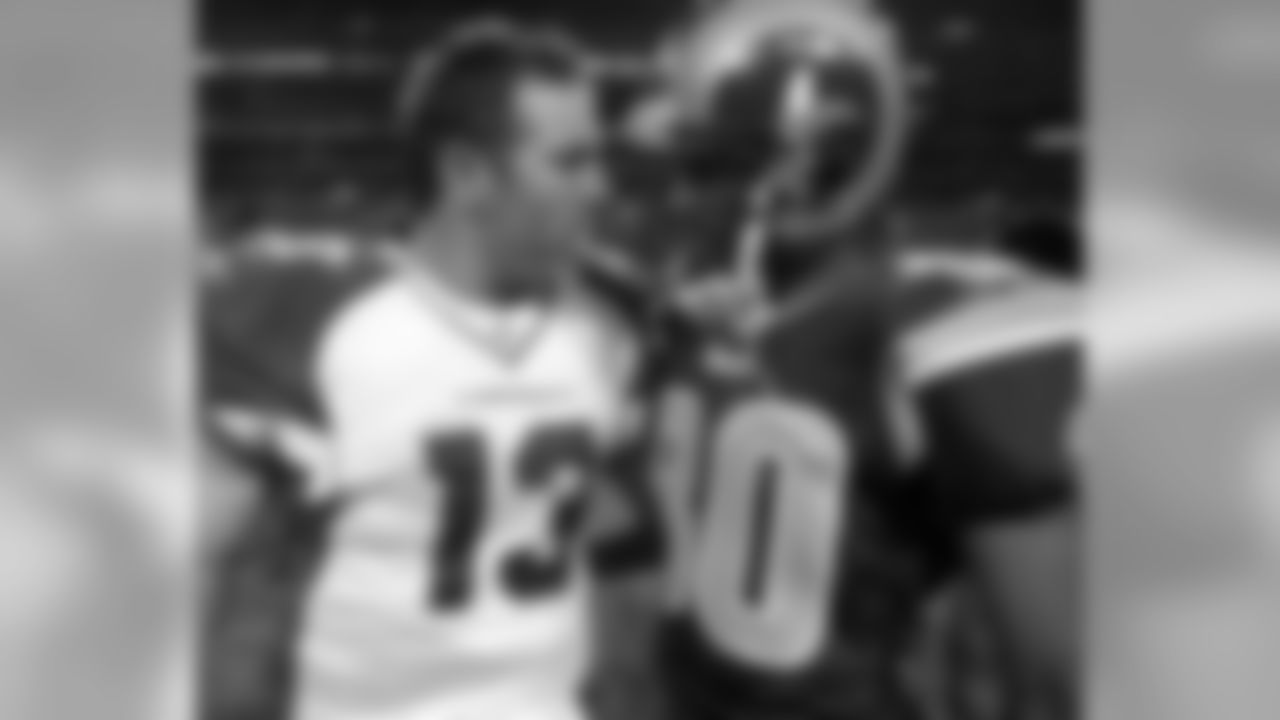 2005: QB Kurt Warner (left) with former teammate, Rams WR Isaac Bruce