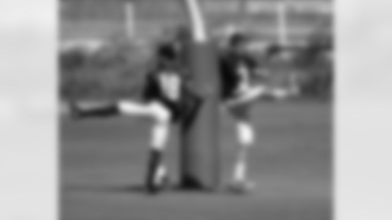 Kerry Taylor and Carson Palmer warm up