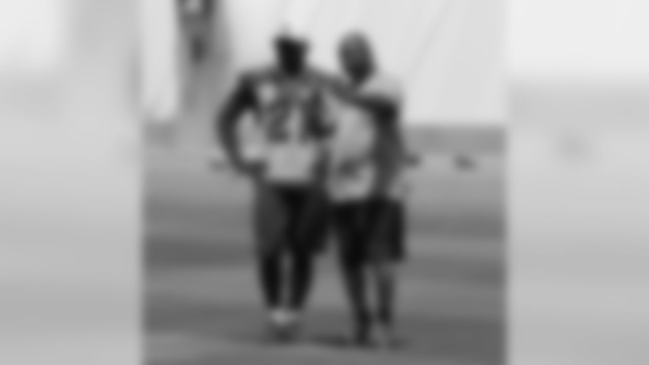 Cornerbacks coach Kevin Ross gives pointers to CB Patrick Peterson