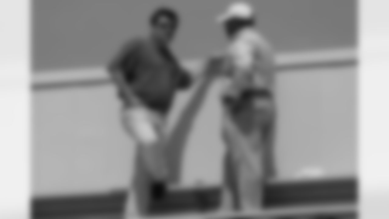 Michael Bidwill and Rod Graves discussing business in the stands