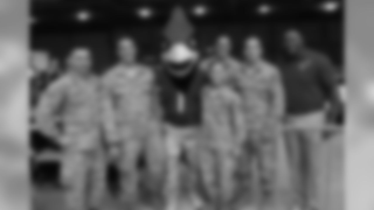 Big Red with members of the military on Salute to Service day