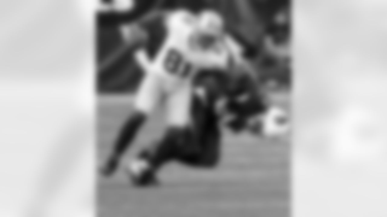 Anquan Boldin breaks a tackle attempt by Jerraud Powers.