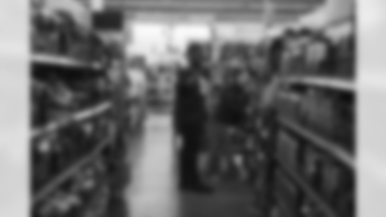 The Arizona Cardinals participate in Shop With A Jock with Desert Financial Credit Union at Walmart on Tuesday, December 13, 2022 in Tempe, AZ.