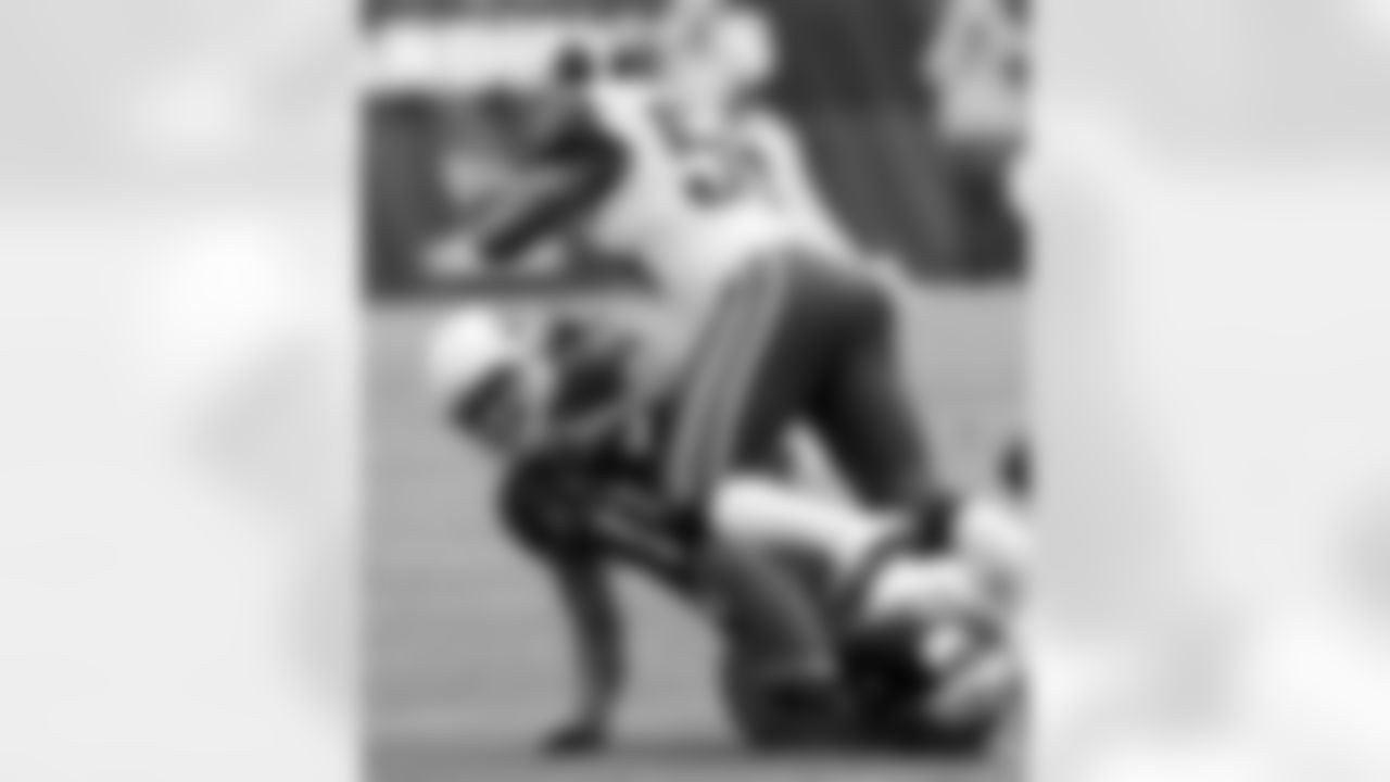 Larry Fitzgerald is tackled by Jo-Lonn Dunbar.