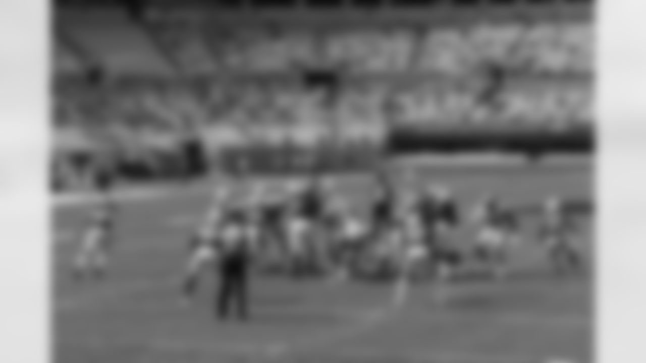 The Carolina Panthers kick an extra point against the Arizona Cardinals during the first half of an NFL football game Sunday, Oct. 4, 2020, in Charlotte, N.C. A limited number of fans are spread out in the stands.