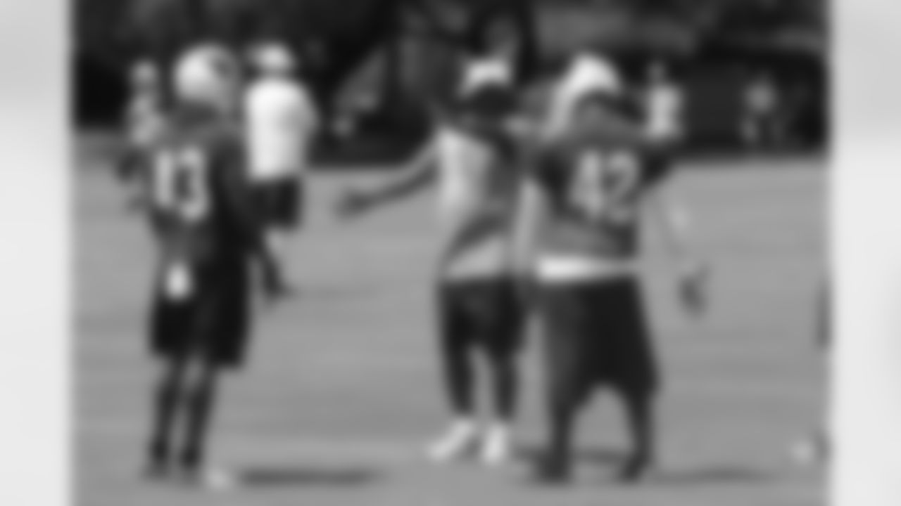 DBs coach Kevin Ross works with Ronnie Yell (43) and Josh Hill (42)