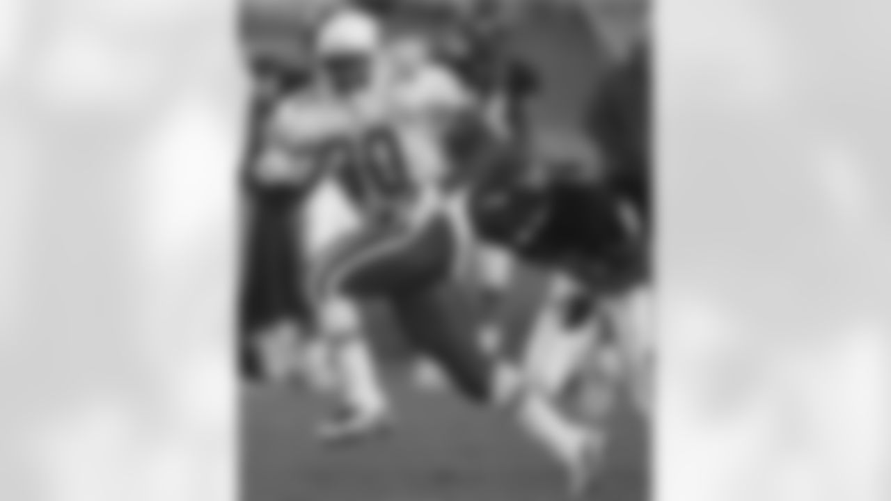 1997: Cards RB Leeland McElroy runs as Tom Carter gives chase