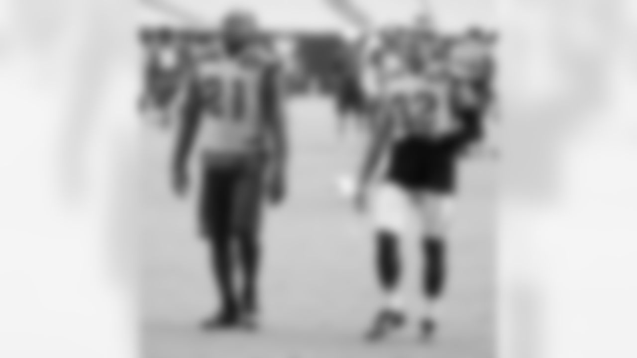 CB Patrick Peterson and S Tyrann Mathieu leave the field after the final practice