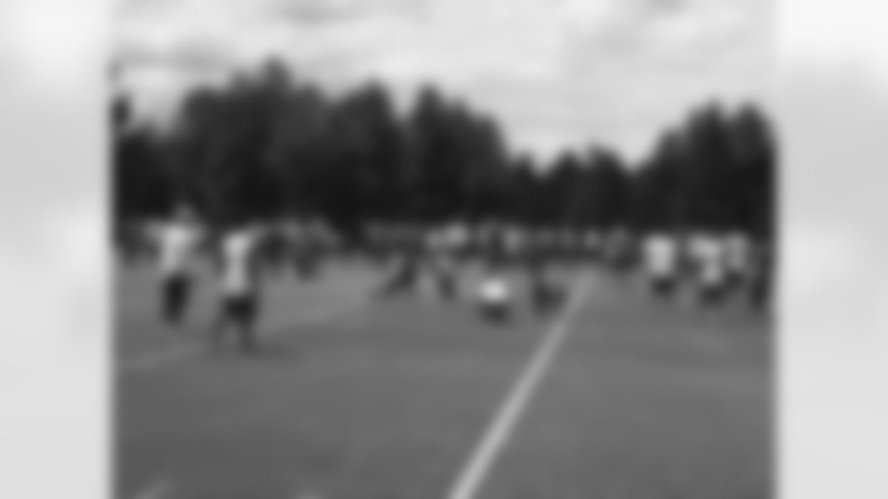 Players stretch prior to the conditioning test