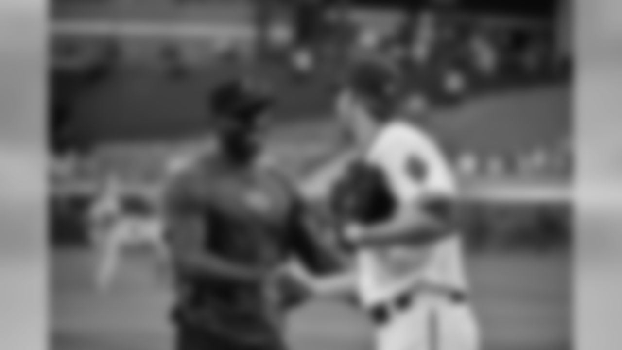 CB Patrick Peterson shakes the hand of Archie Bradley after throwing out the ceremonial first pitch