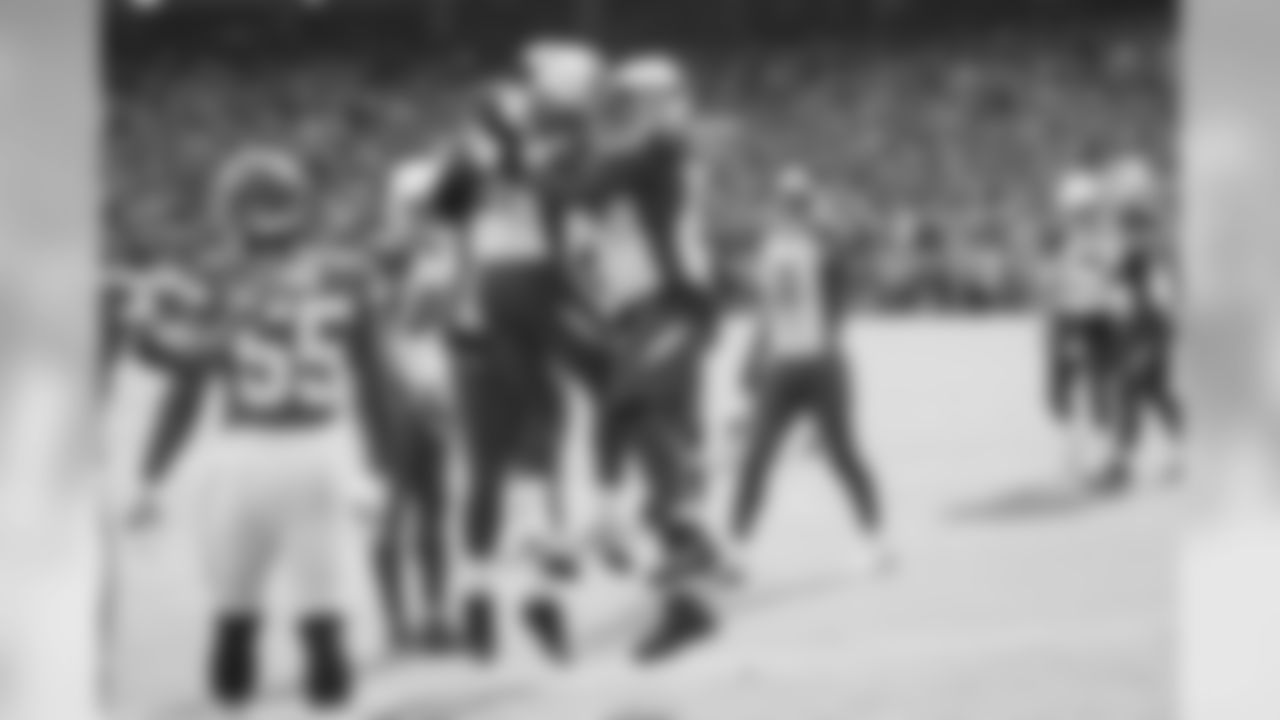 David Johnson celebrates with teammates after scoring a touchdown