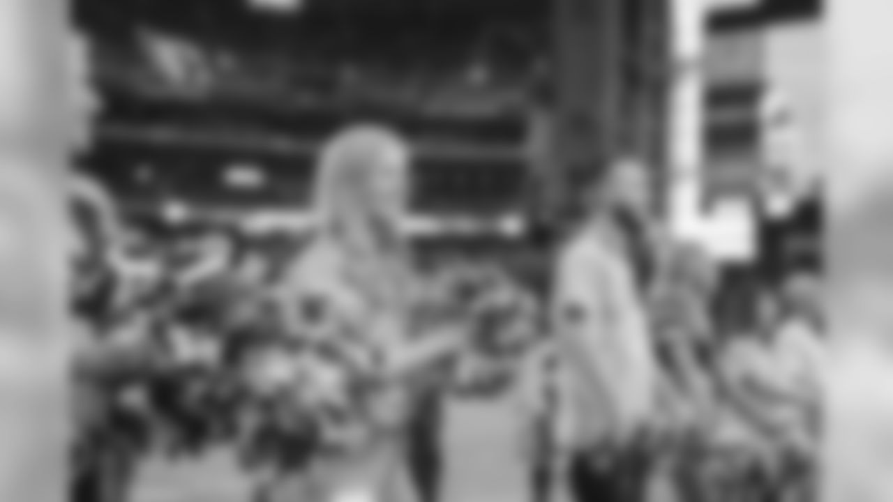 Images from halftime of the Falcons game, where Cardinals cheerleaders performed with cancer survivors and their caregivers to raise awareness for early detection and prevention