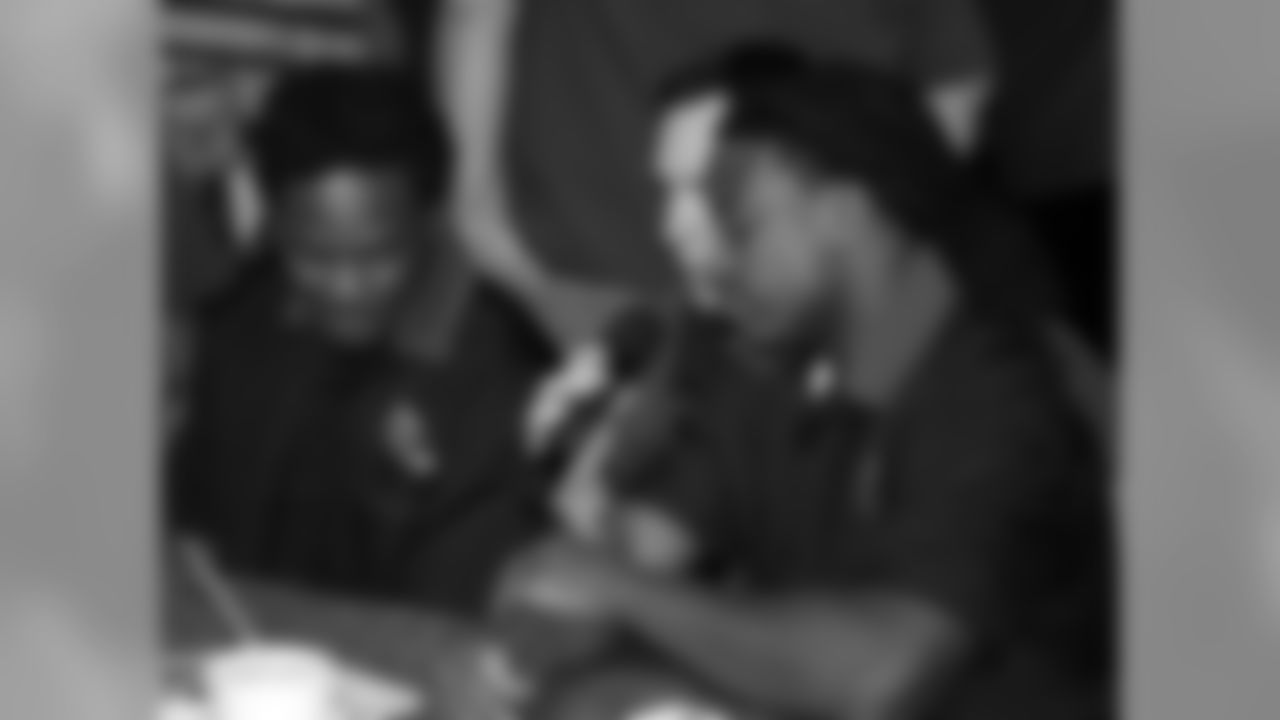 RB Chris Johnson (left) and RB Andre Ellington get interviewed