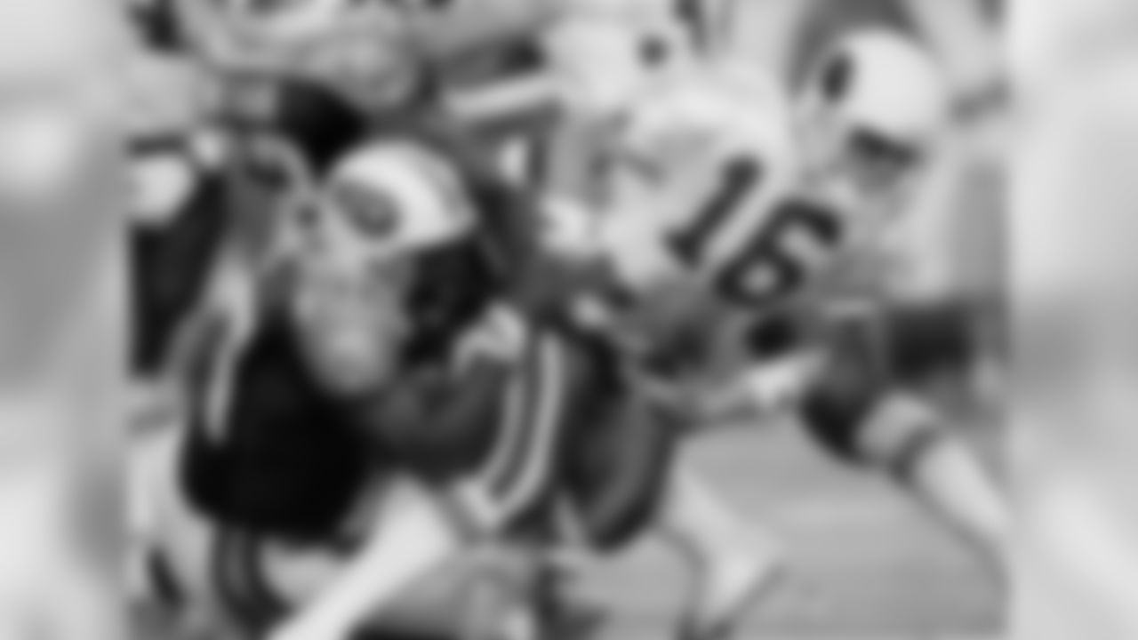 1999: QB Jake Plummer is hauled down by Mike Jones.