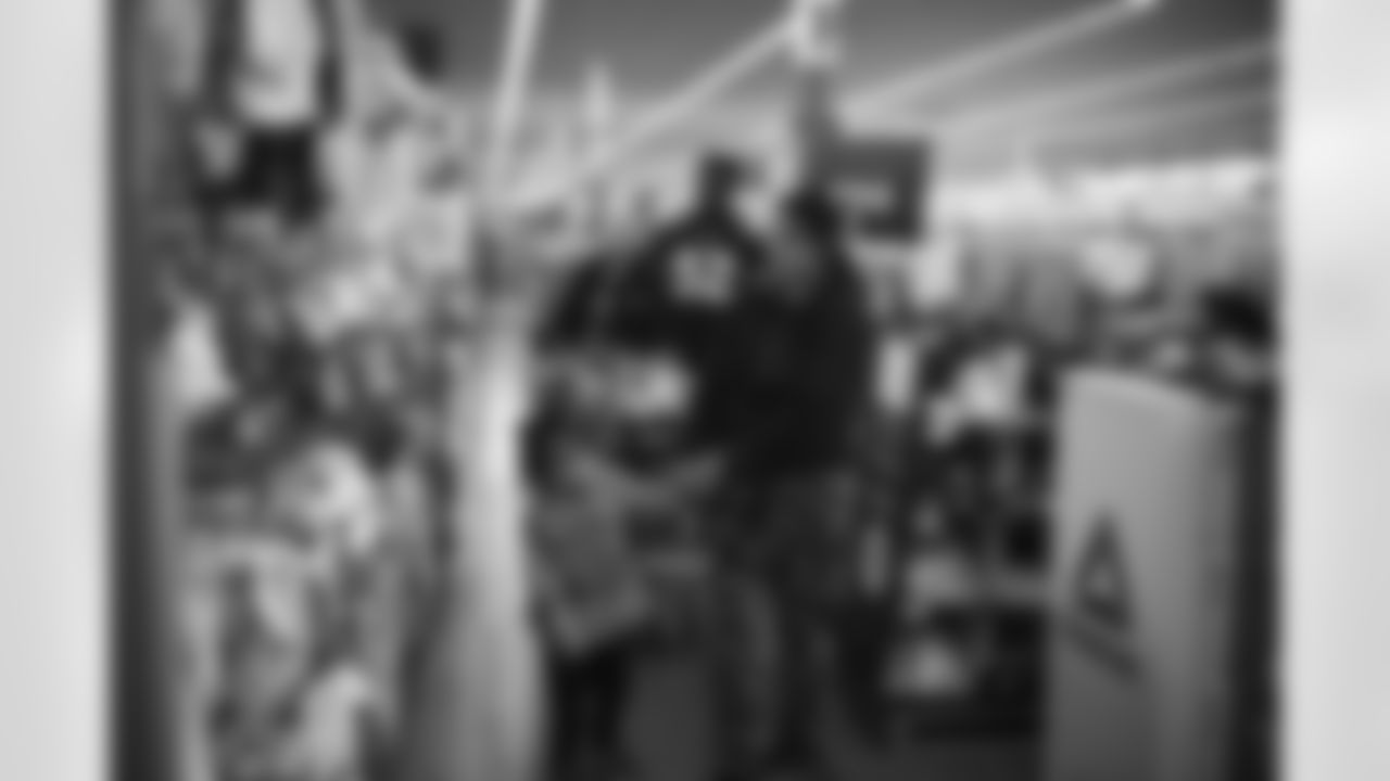 The Arizona Cardinals participate in Shop With A Jock with Desert Financial Credit Union at Walmart on Tuesday, December 13, 2022 in Tempe, AZ.
