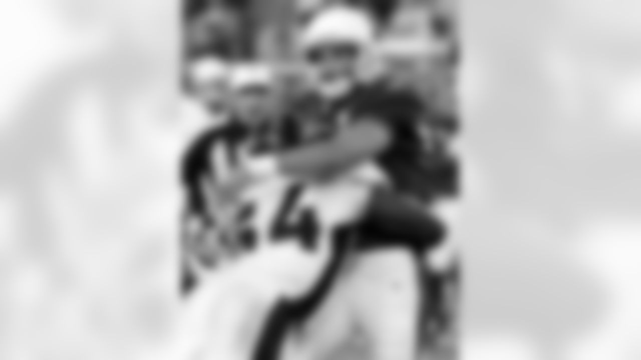 2006: QB Matt Leinart is hit after releasing the ball