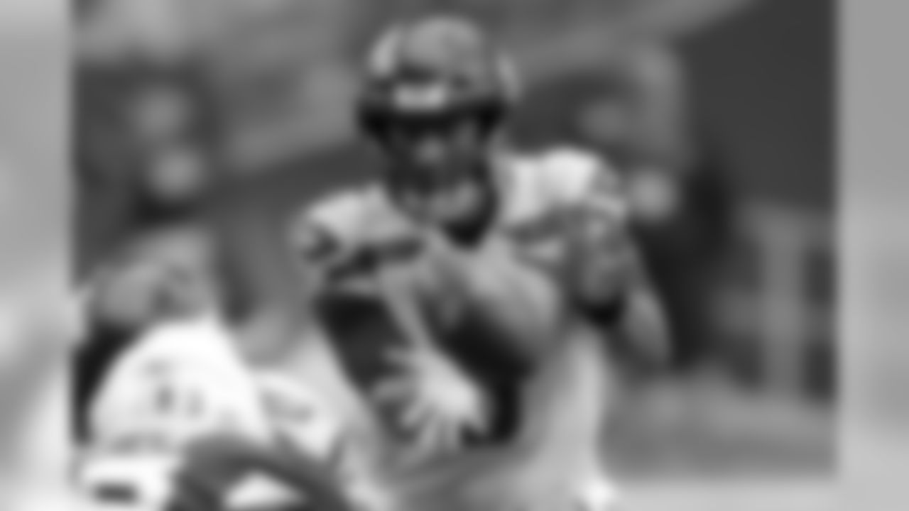 Seahawks quarterback Russell Wilson takes the snap.
