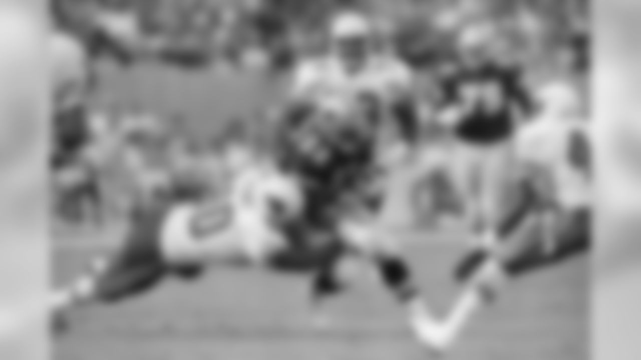 1992: Cowboys RB Emmitt Smith is tackled by LB Tyronne Stowe