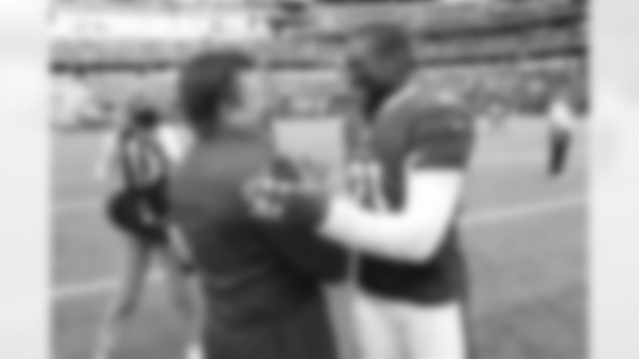 CB Patrick Peterson shares a laugh with team president Michael Bidwill after beating the Cowboys