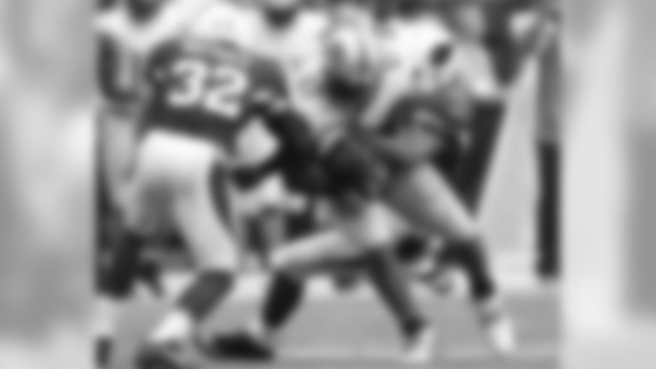 2013: Cardinals S Tyrann Mathieu and LB Karlos Dansby combine on a tackle of Lions TE Brandon Pettigrew