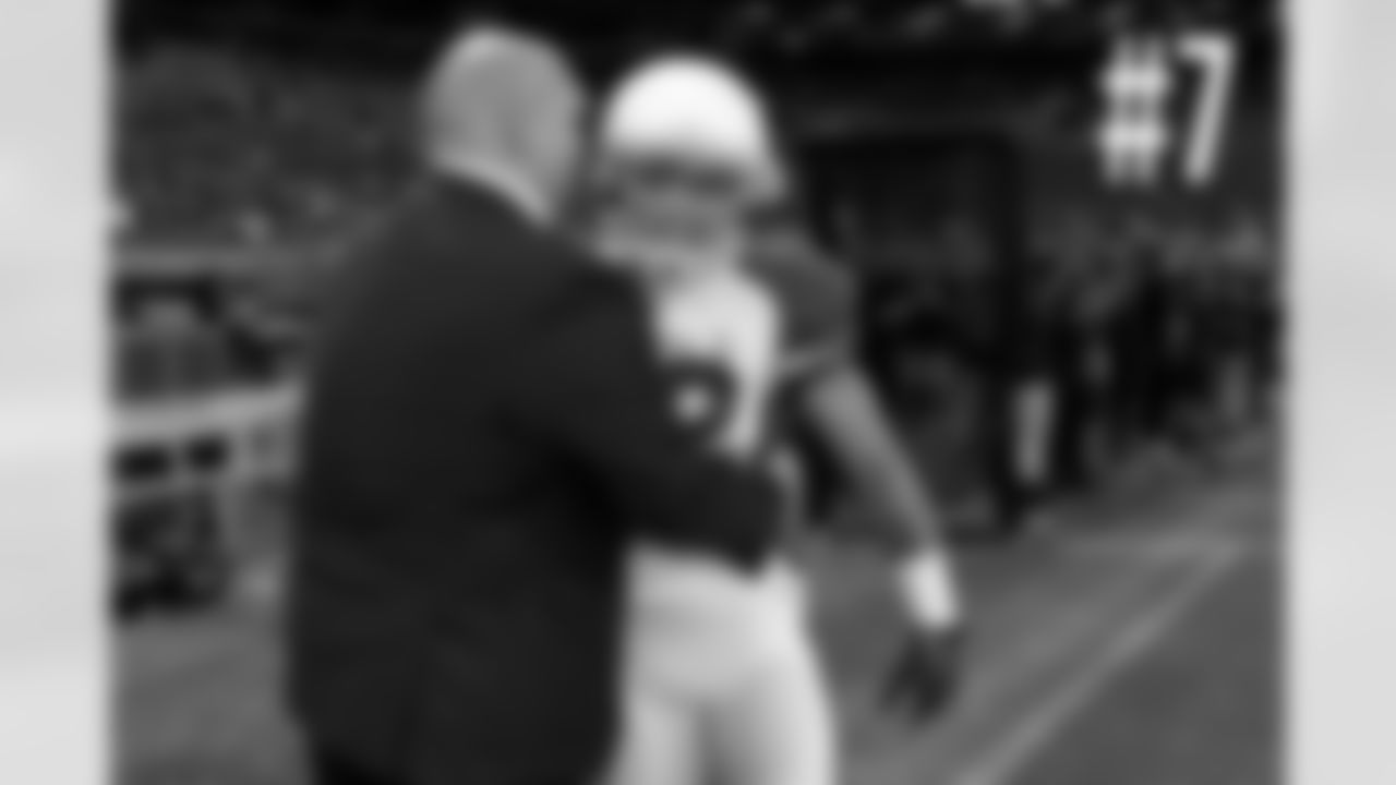 7 GM Steve Keim and Tyrann Mathieu share a hug before kickoff