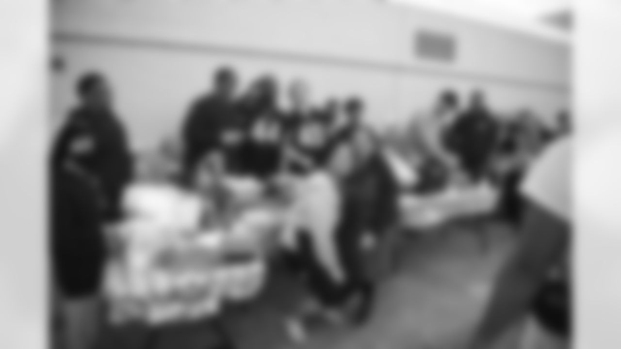 Arizona Cardinals Legends and current players serve food and sign autographs at Luke Air Force Base for Feed the Flight Line on Thursday, March 2, 2023 in Glendale, AZ.
