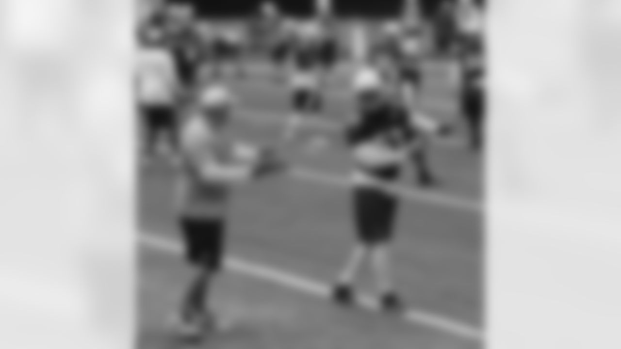 LB John Abraham gets pointers from LB coach James Bettcher