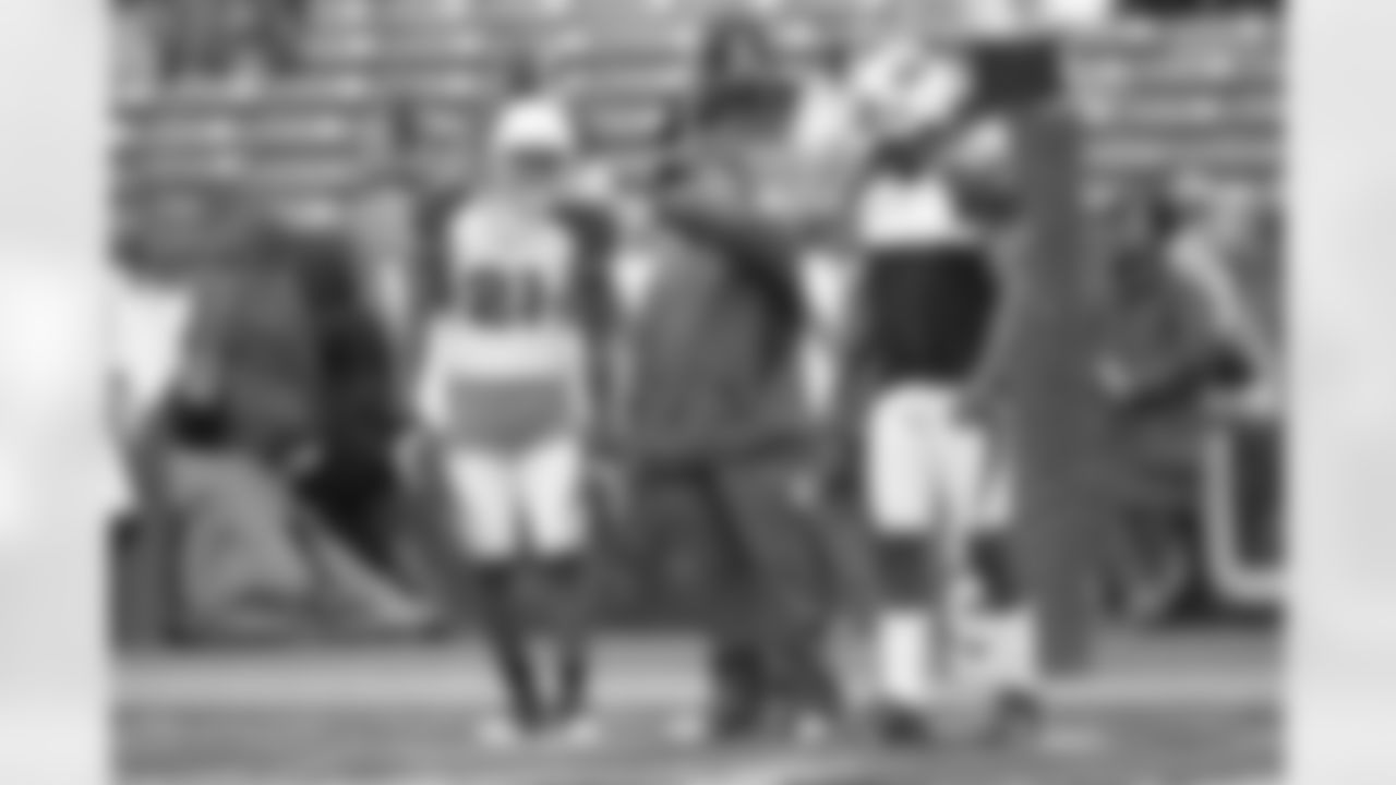 Patrick Peterson and Adrian Wilson receiving instruction