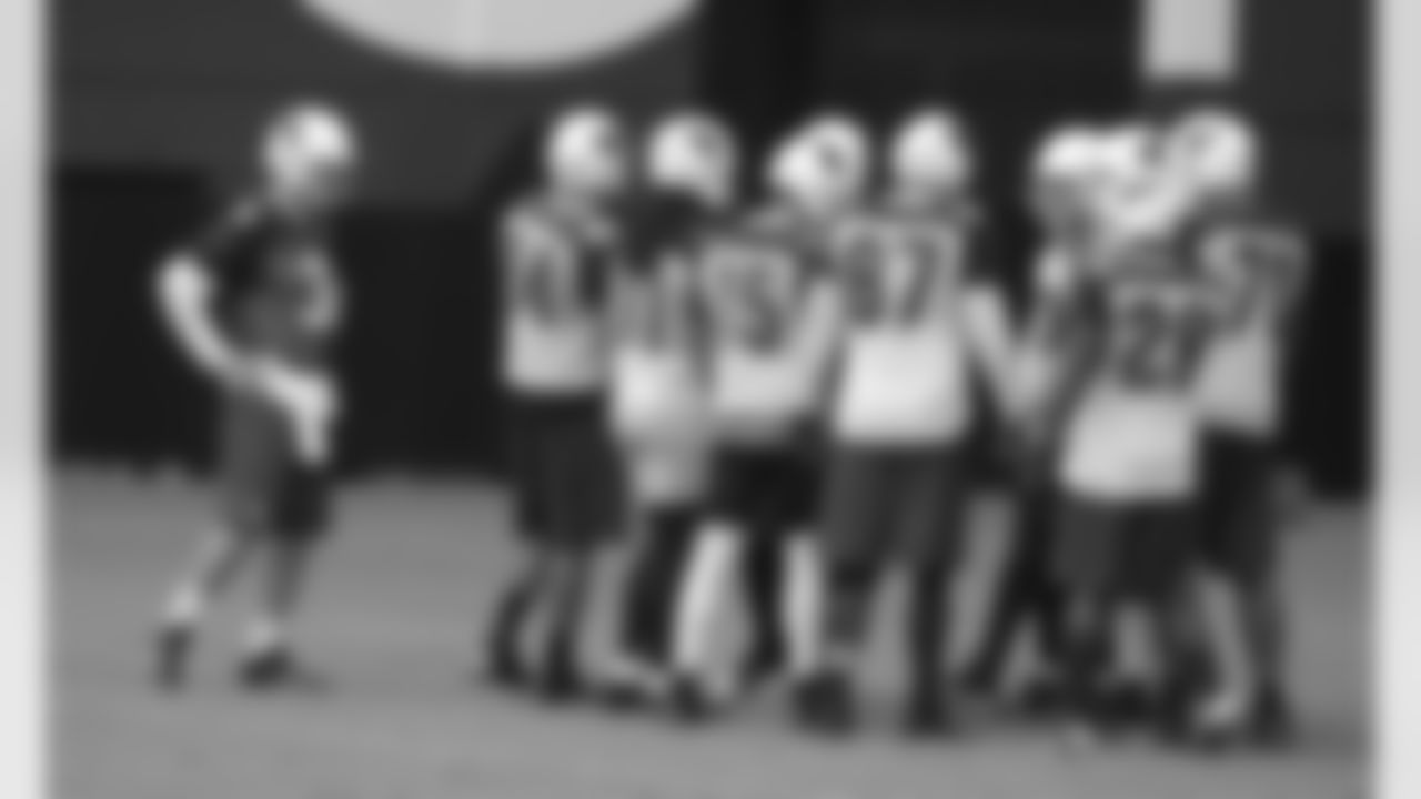 Palmer (3) waits for the play before joining the huddle