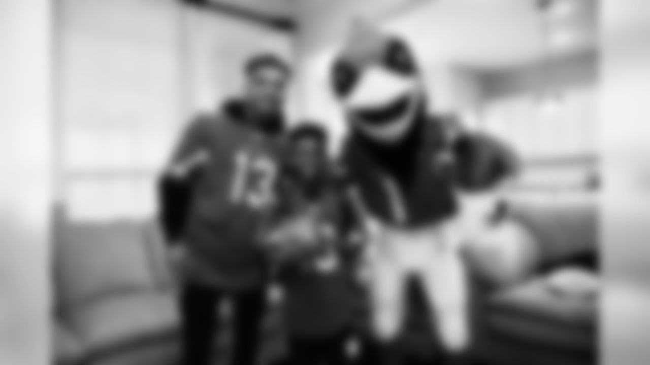 Images of Cardinals receiver Christian Kirk delivering surprise Super Bowl tickets to Devin Manigo at his home in Texas